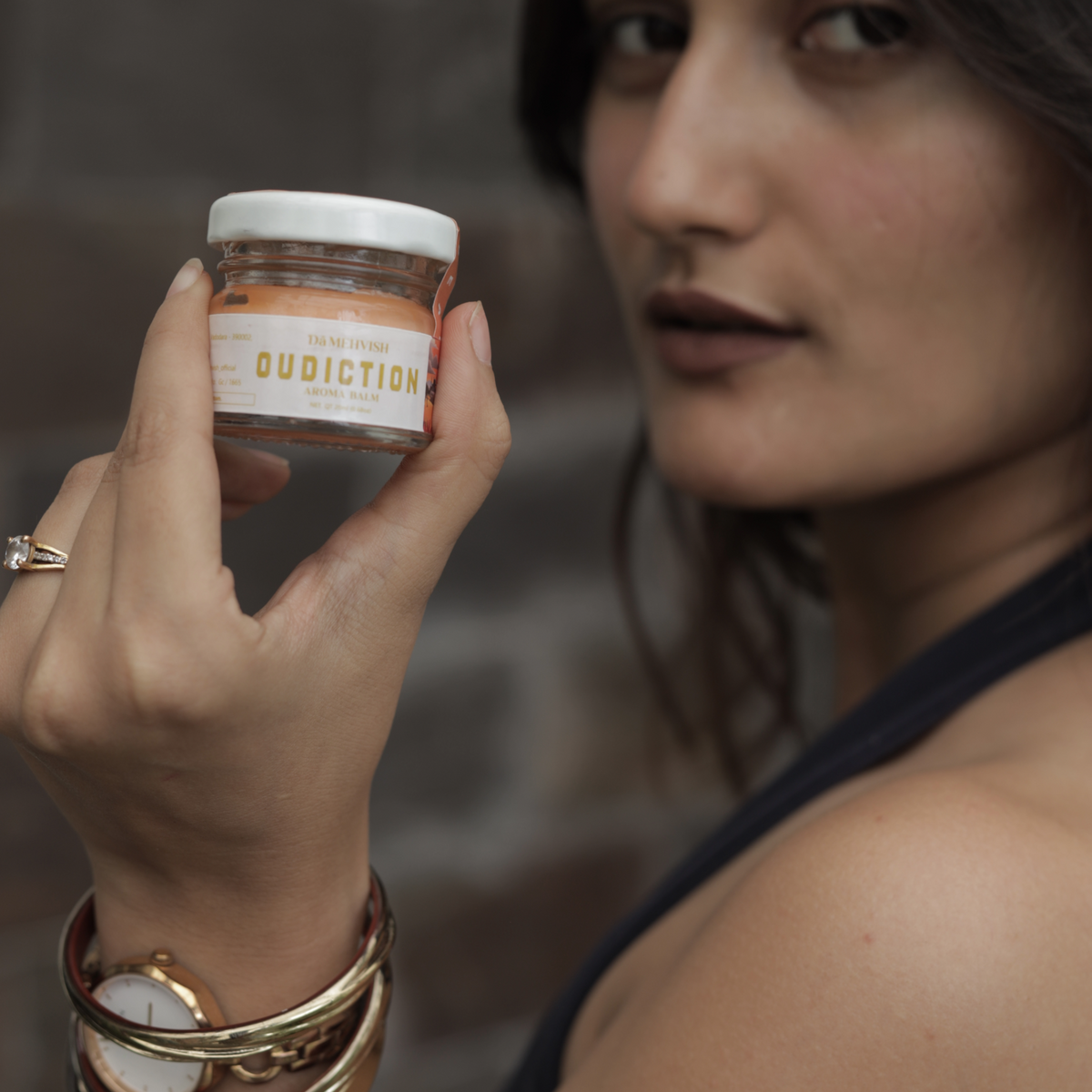 Oudiction solid perfume by Dã Mehvish with female model